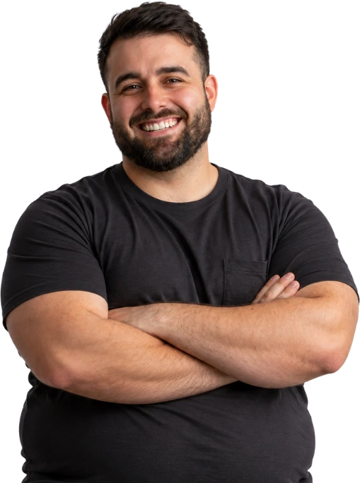 Smiling man with his arms crossed